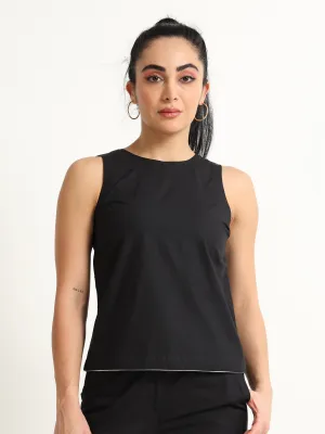 Organic Black cotton Closed neck sleeveless top with white piping detailing at the hem line.