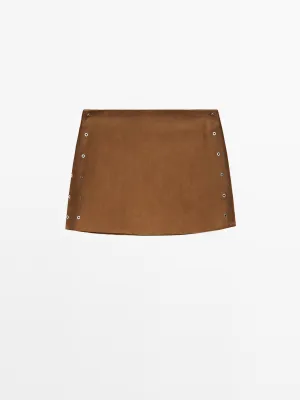 Suede leather mini skirt with eyelets