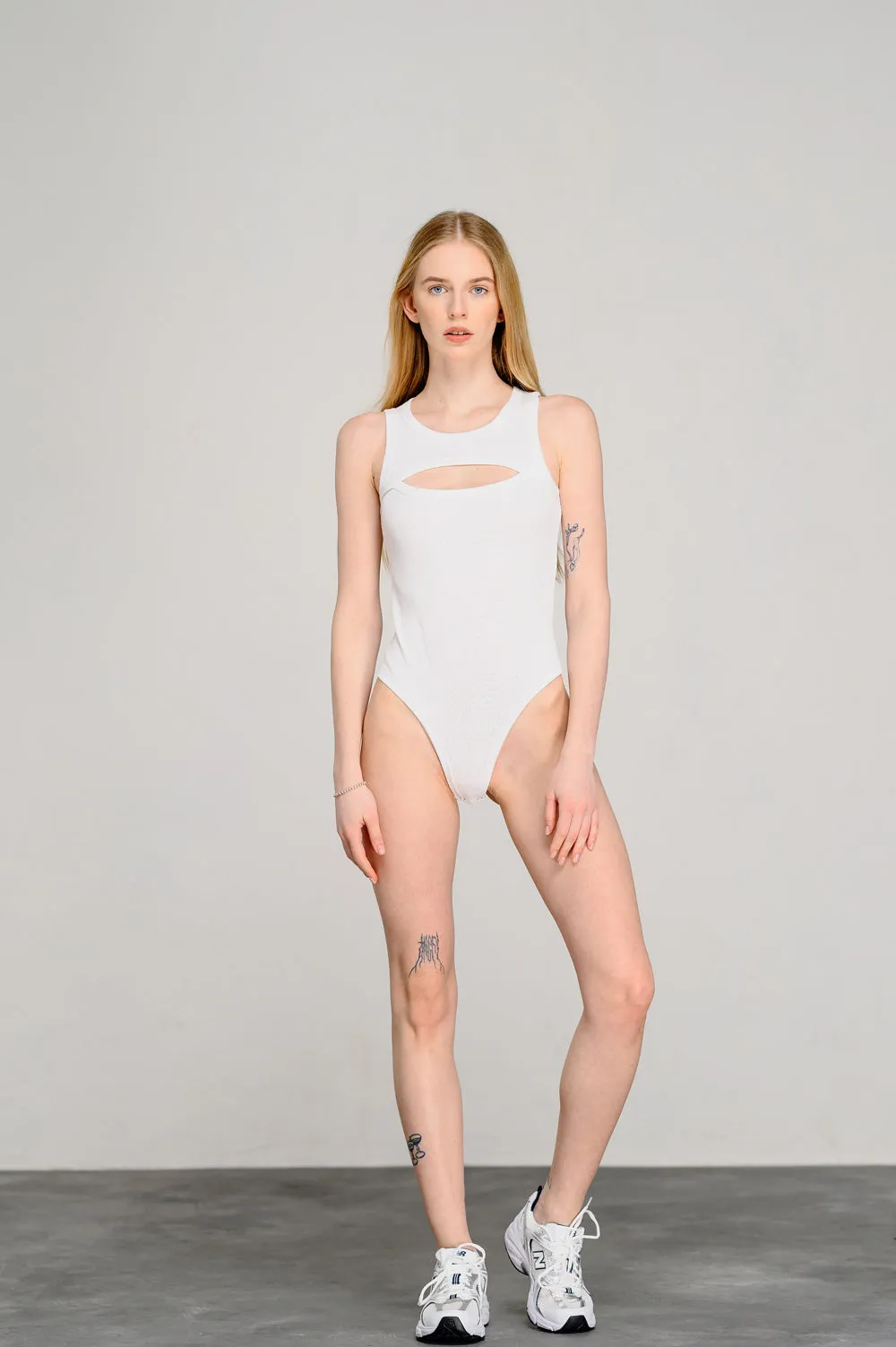 White stylish bodysuit with a figured neckline